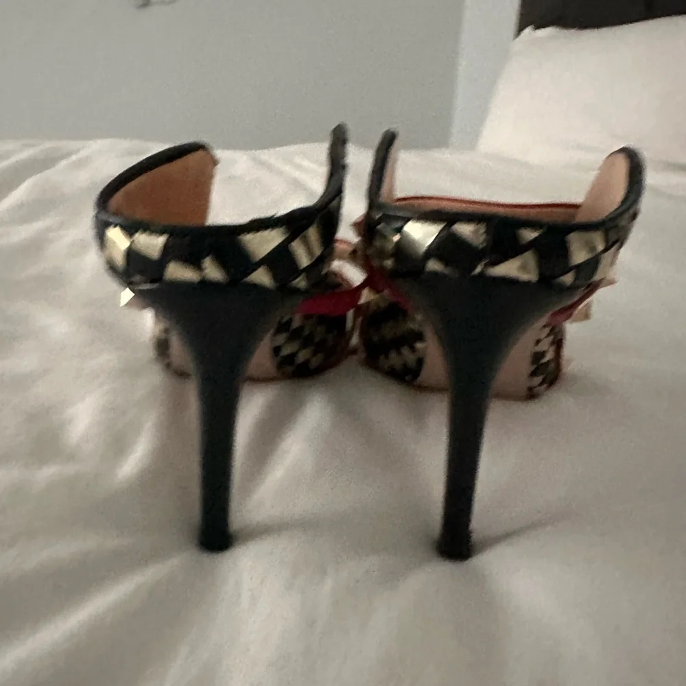 Elegant Black and Gold Checkered Heels with Red Accents